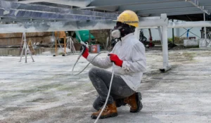 The painter is working to fireproof paint