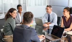 people in meeting working together