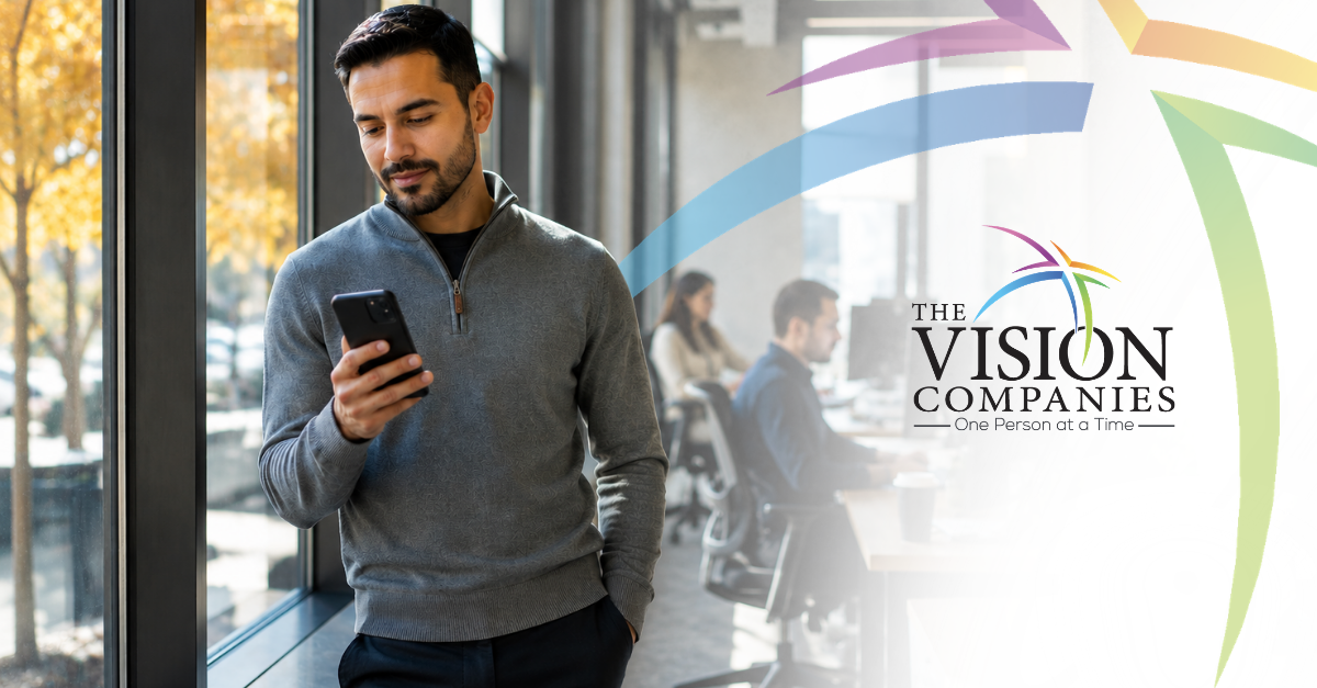 HR professional reviewing wage competition data on mobile phone in modern office